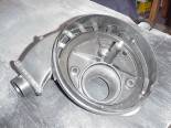 Here is the inside of the stock air filter backing plate. We'll take that snorkle off and fill in the intake holes later. 