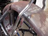 To make the sissy bar fit the 6" flat fender AND the Vulcan swing arm a lot of cutting and grinding was needed.  Surprised?   
