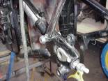 The left side of the Vulcan swing arm is straight. The right side has a dog leg bend.  This presented a challange while trying to mount the sissy bar. 