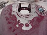 If you'll look at a stock Vulcan 800 tank you'll see 4 "bubbles" around the mounting plate for the nacelle.  These are locating points so the factory will know where the mounting plate goes.  The plate is then spot welded to the top of the tank.  You can't grind these bubbles down because you'll make a hole in the tank. I had to use a hammer and chisel to knock them down. 